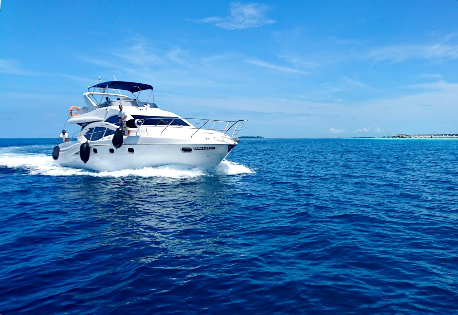 A motor yacht underway on open blue water
