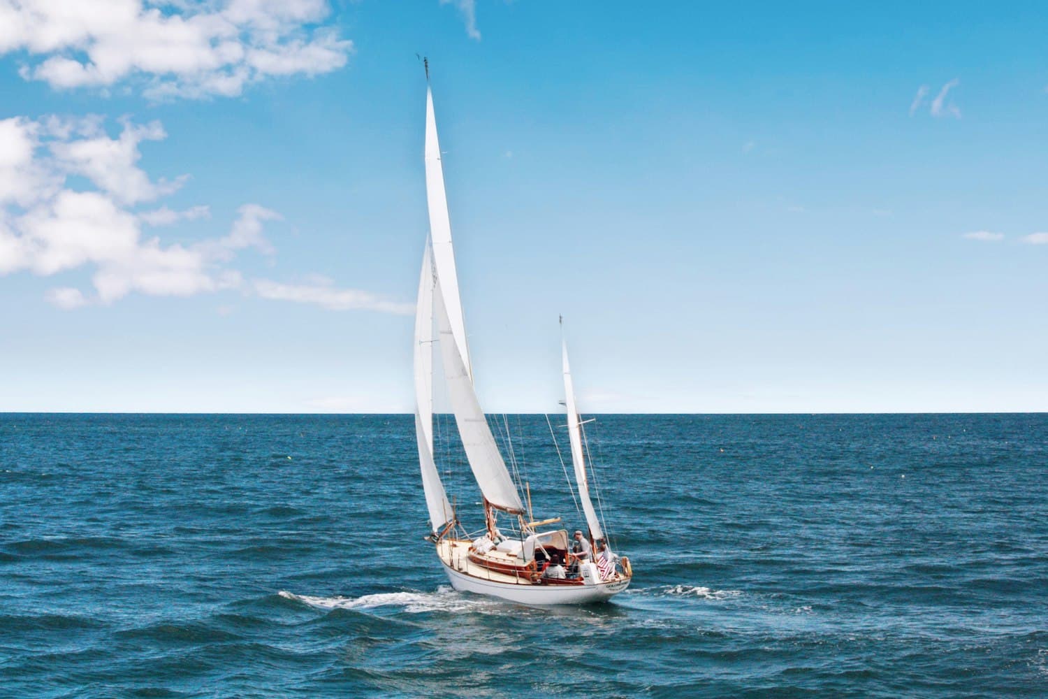 A sailing yacht under full sail on open water